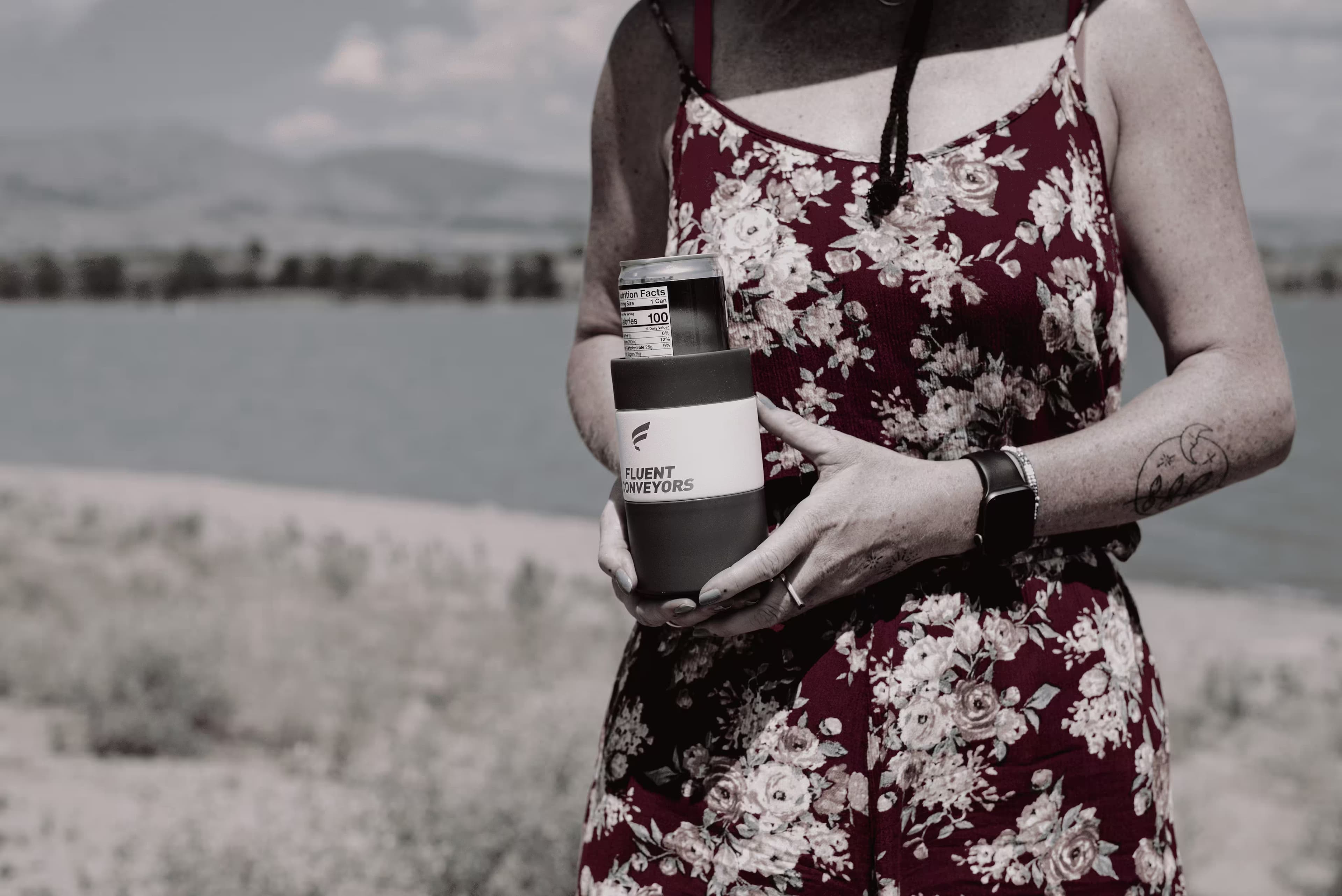 Branded koozie holding a beverage can