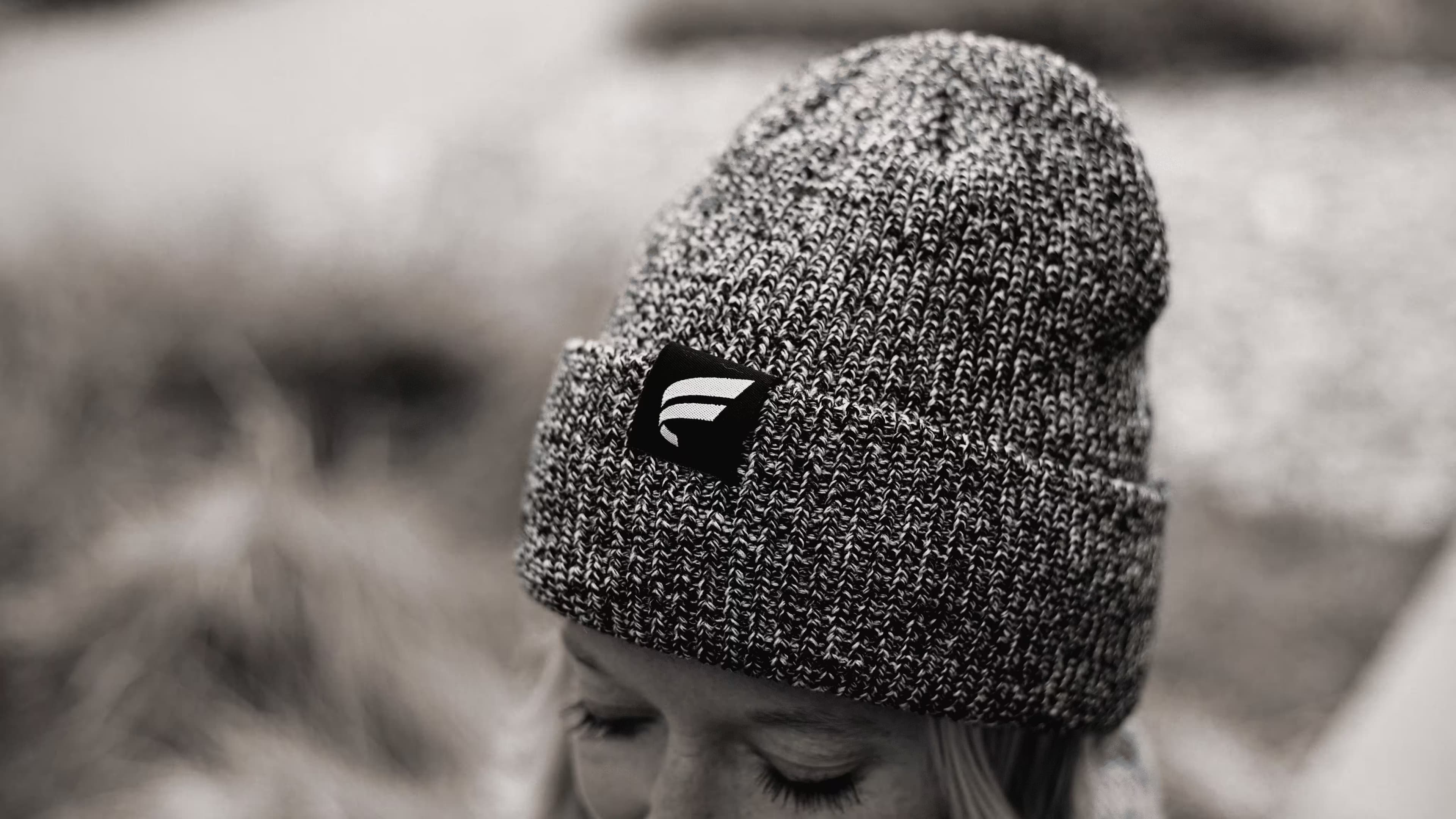 Grey knit beanie with Fluent branded tag