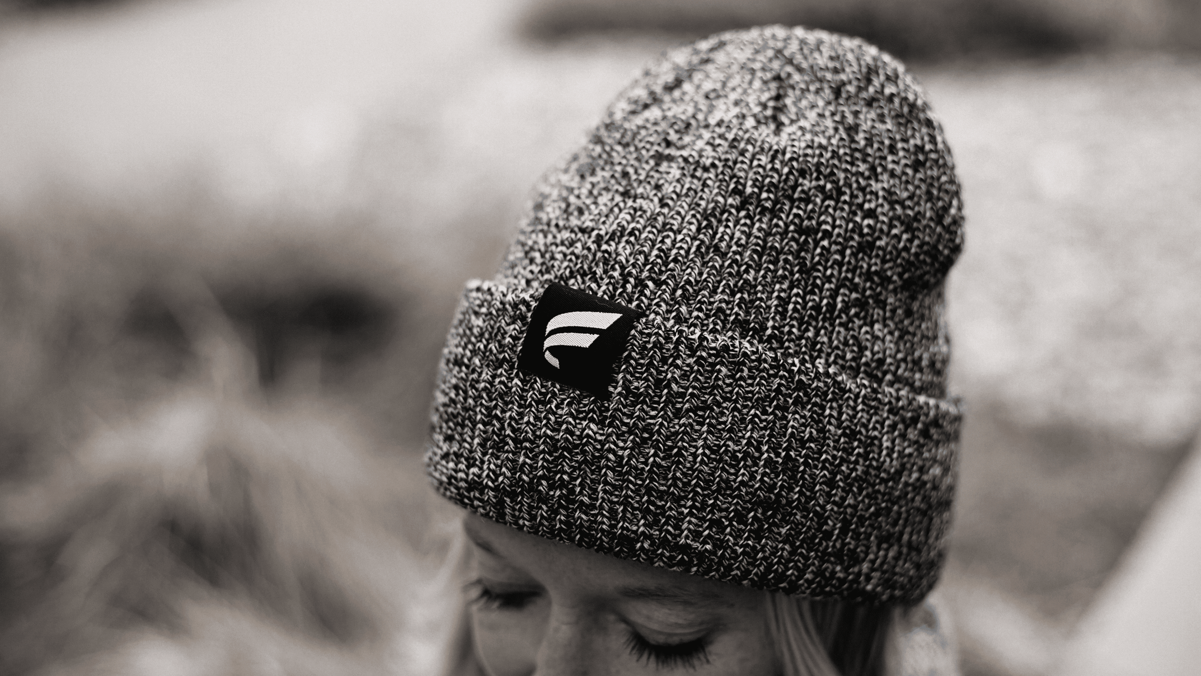 Grey knit beanie with Fluent branded tag