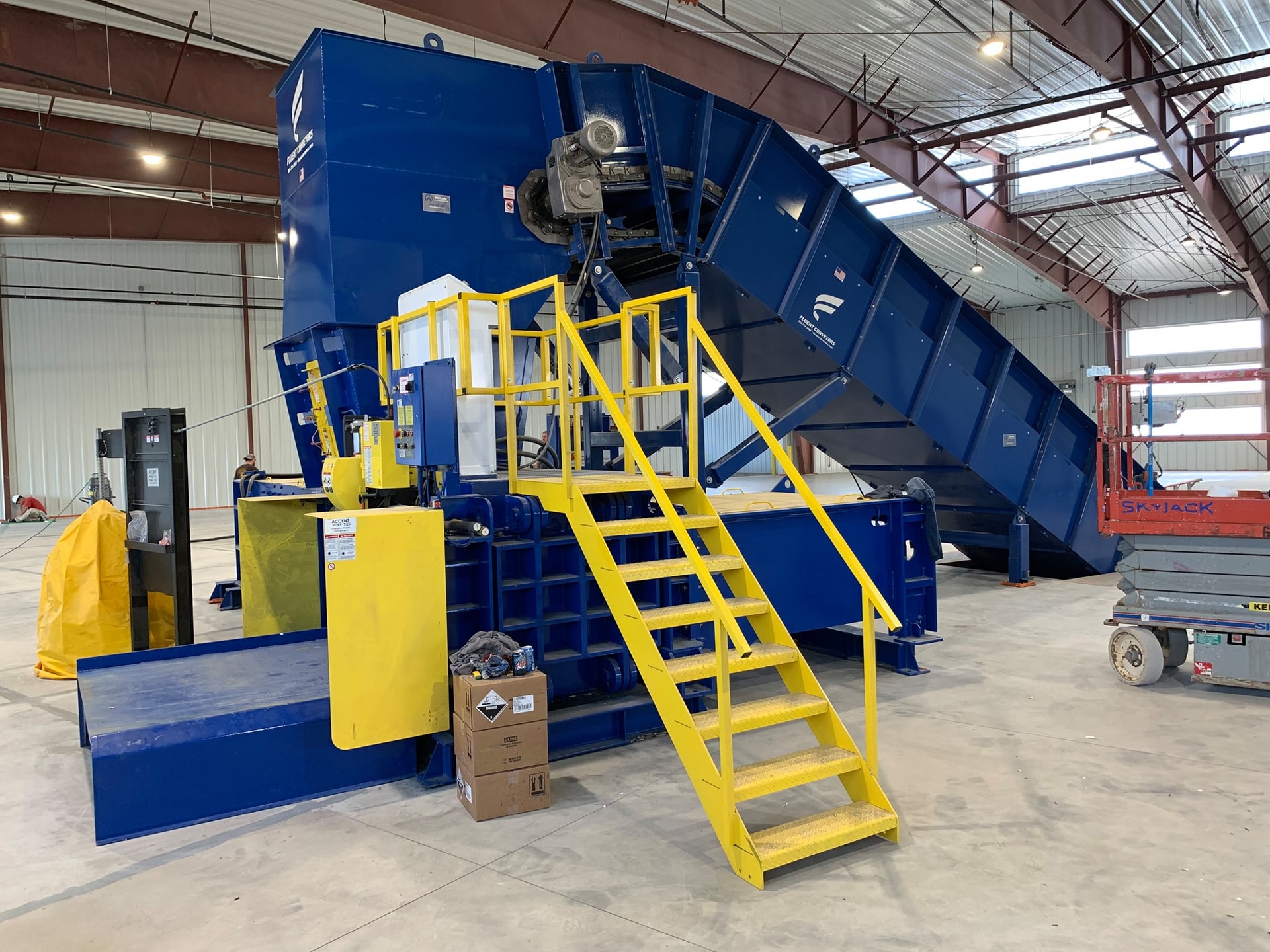 Single Stream Baler Infeed Conveyor & International Baler Two Ram in Casper, WyomingFluent Conveyors | Leading Conveyor Systems Manufacturer